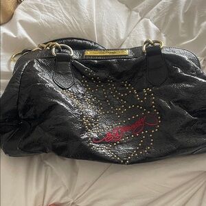 Ed Hardy Black Patent Shoulder Bag with Gold Stud Accents and Red Signature